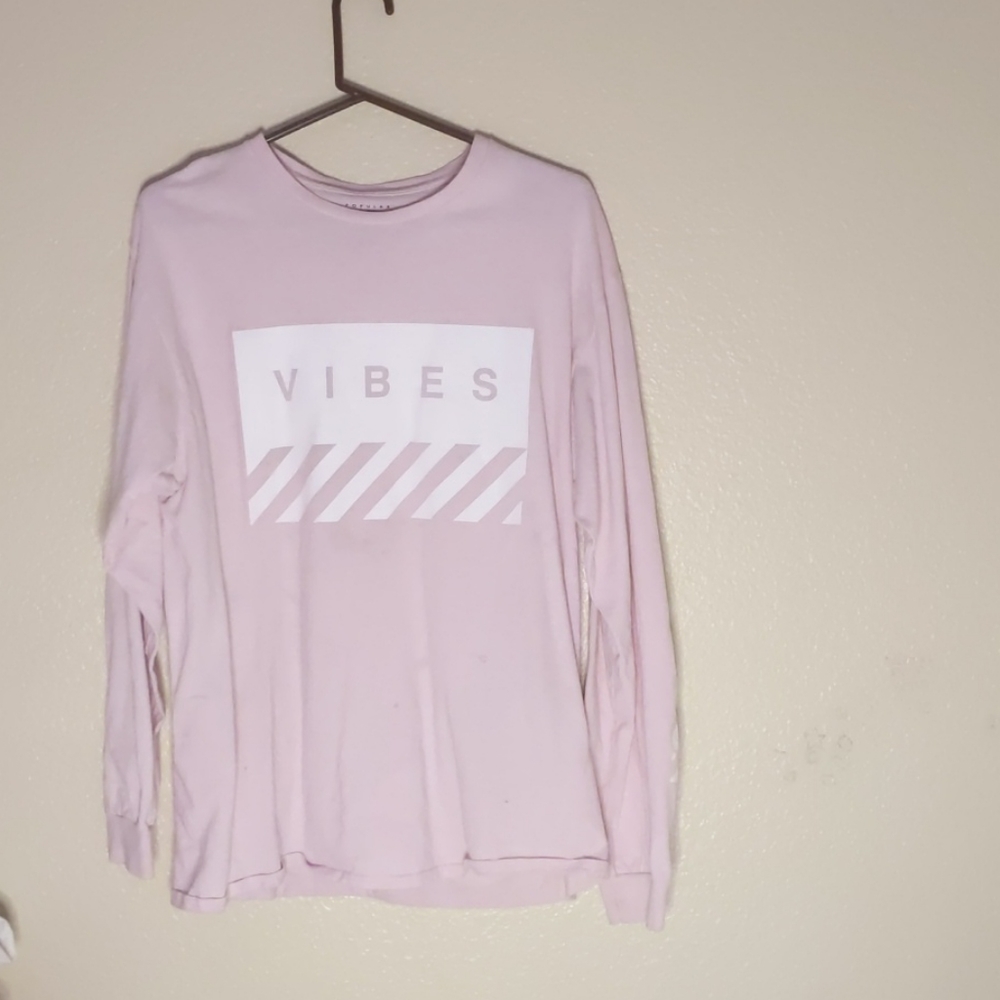 Light pink long sleeve top w/ "vibes" on the front